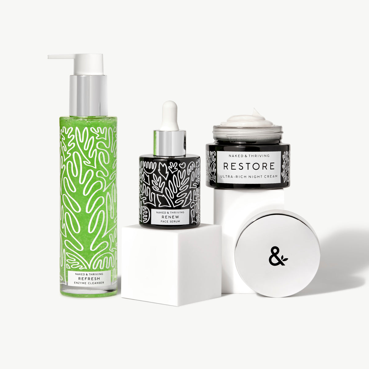 Naked & Thriving Advanced Renewal Routine of botanical-patterned bottles and jars