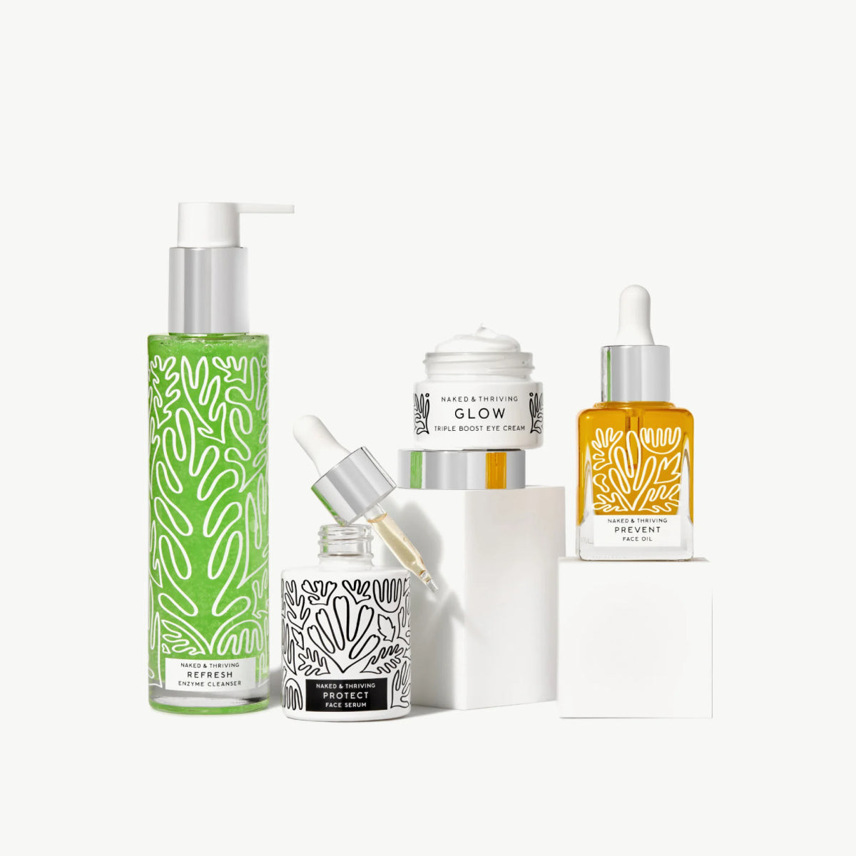 
                
                  Naked & Thriving Age-Defying Routine of botanical-patterned bottles and one jar
                
              