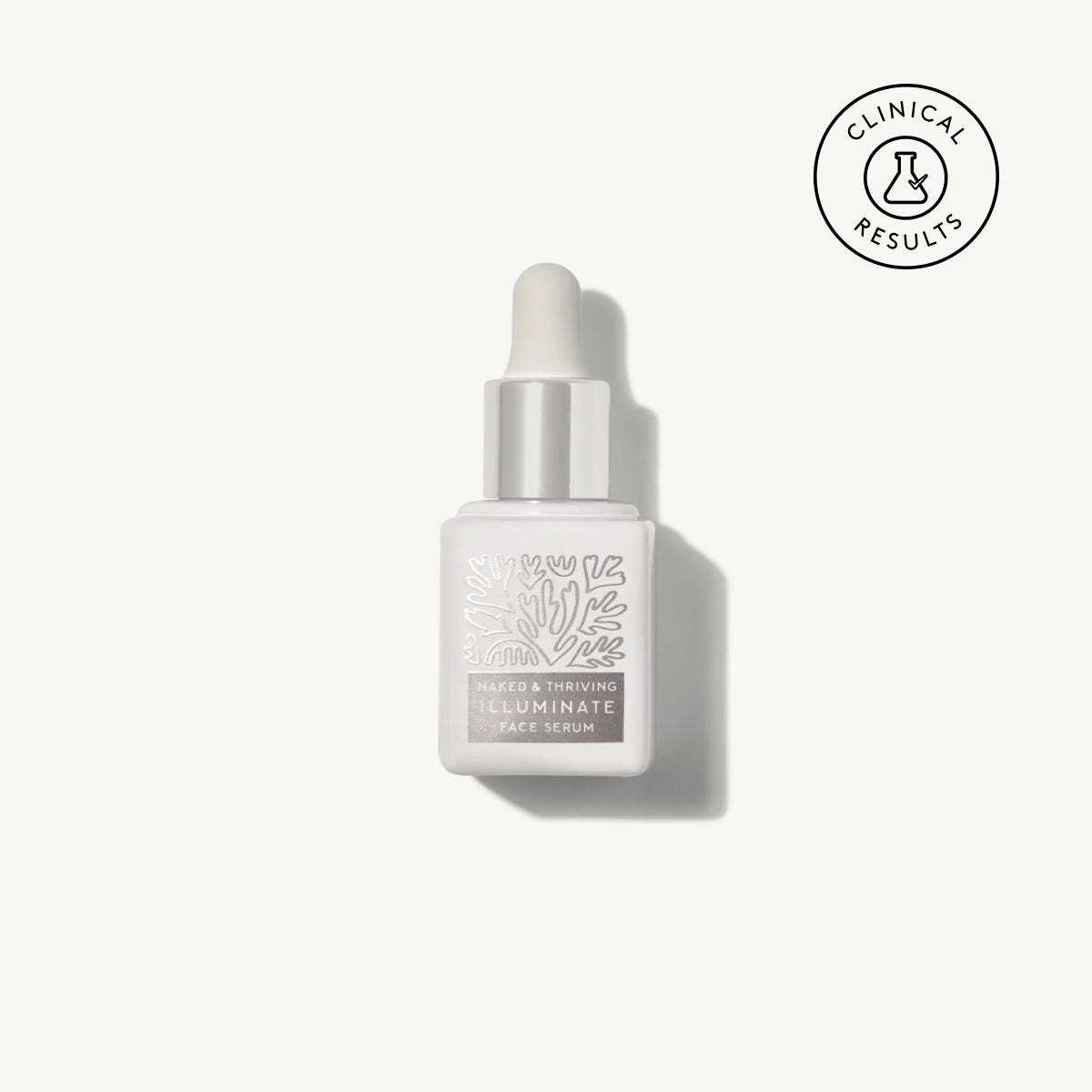 Naked & Thriving travel-size Illuminate BC+ Brightening Serum in white glass dropper bottle with botanical pattern