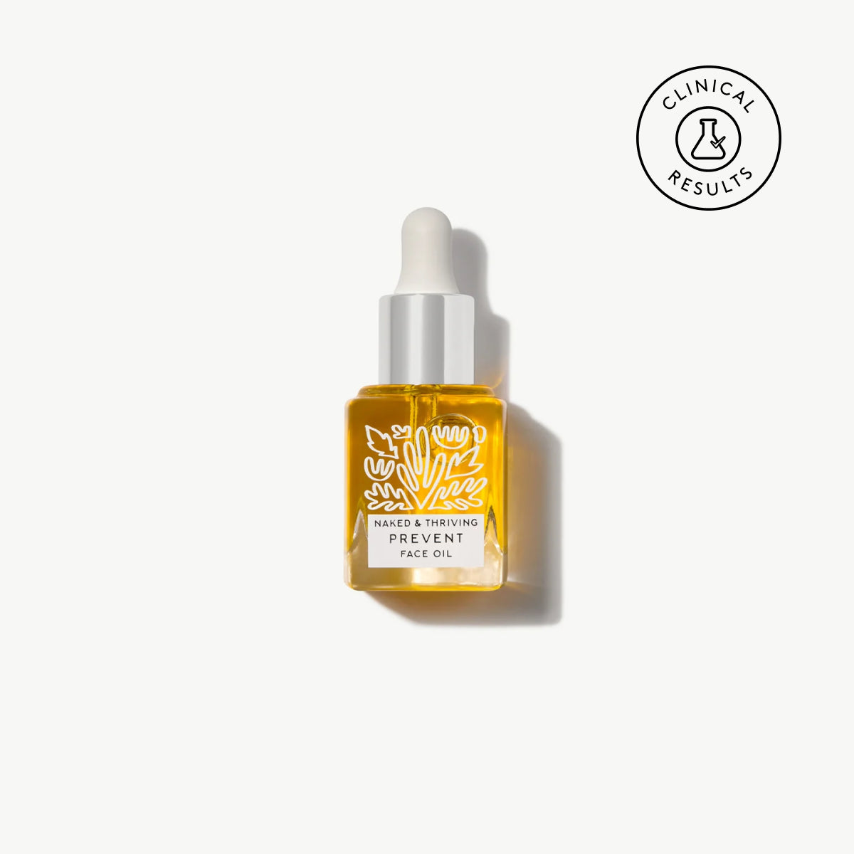 Naked & Thriving travel-size Prevent Anti-Aging Face Oil in a clear, botanical-patterned glass bottle 