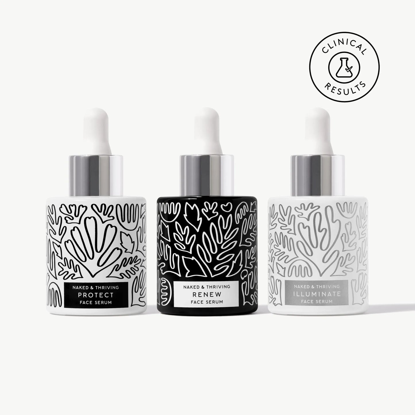 Naked & Thriving Radiant Serum Set with 3 botanical-patterned glass bottles
