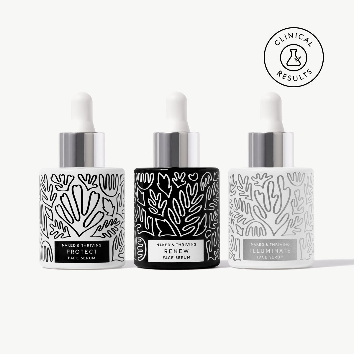 Naked & Thriving Radiant Serum Set with 3 botanical-patterned glass bottles