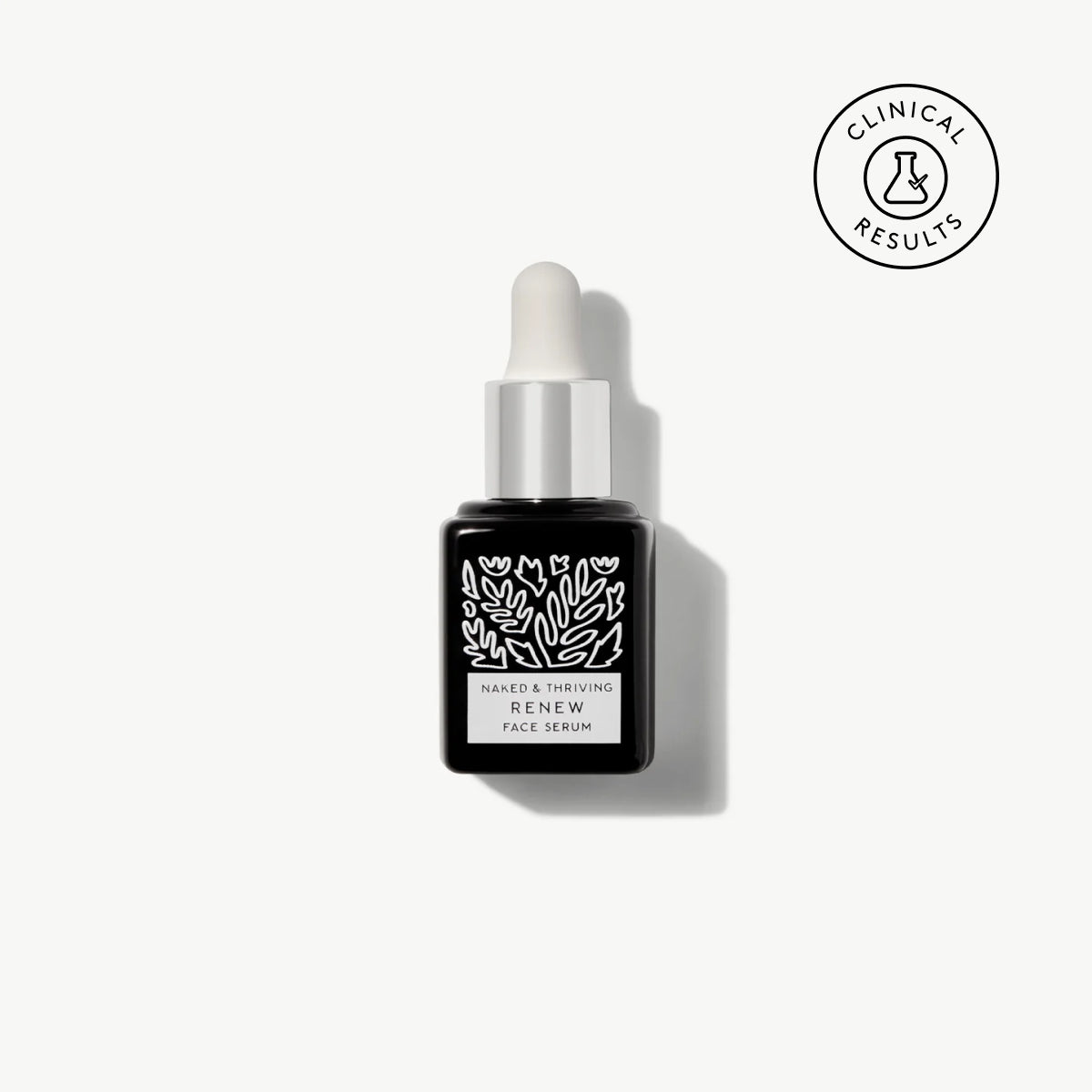 Naked & Thriving travel-size Renew Resurfacing Night Serum in black glass dropper bottle with white botanical pattern