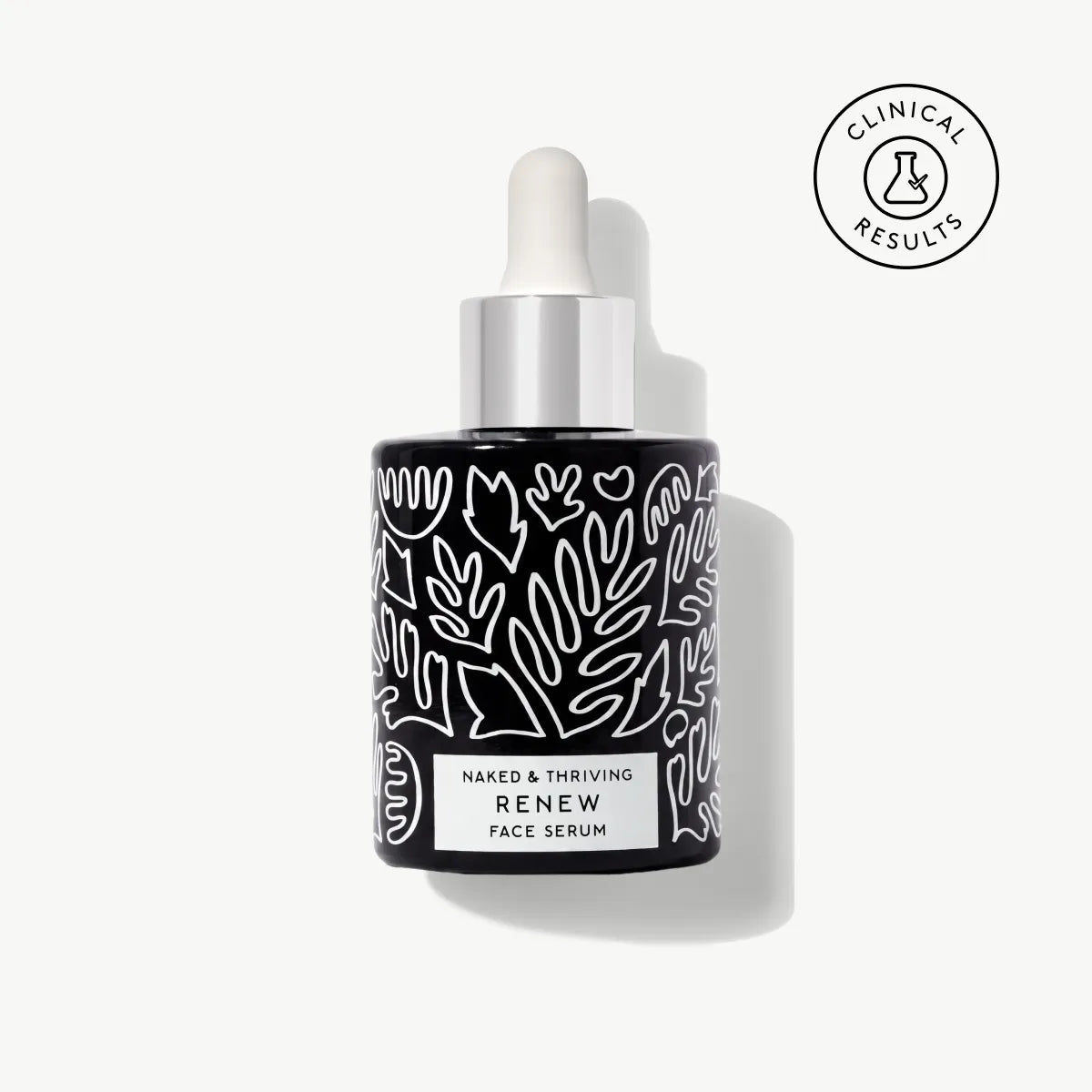 
                
                  Naked & Thriving deluxe-size Renew Resurfacing Night Serum in black glass dropper bottle with white botanical pattern
                
              