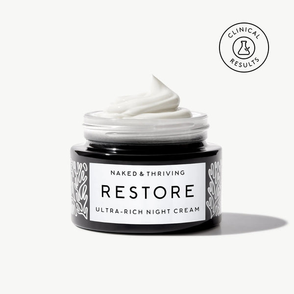Naked & Thriving Restore Ultra-Rich Night Cream in a black glass jar with brand label