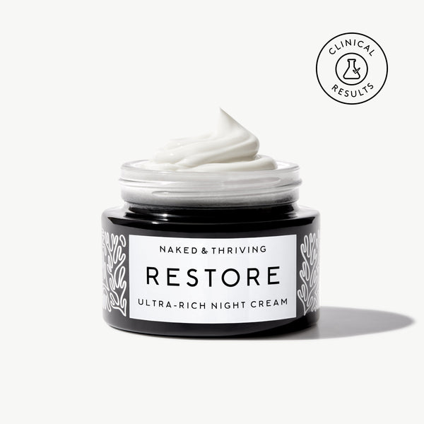 Naked & Thriving Restore Ultra-Rich Night Cream in a black glass jar with brand label