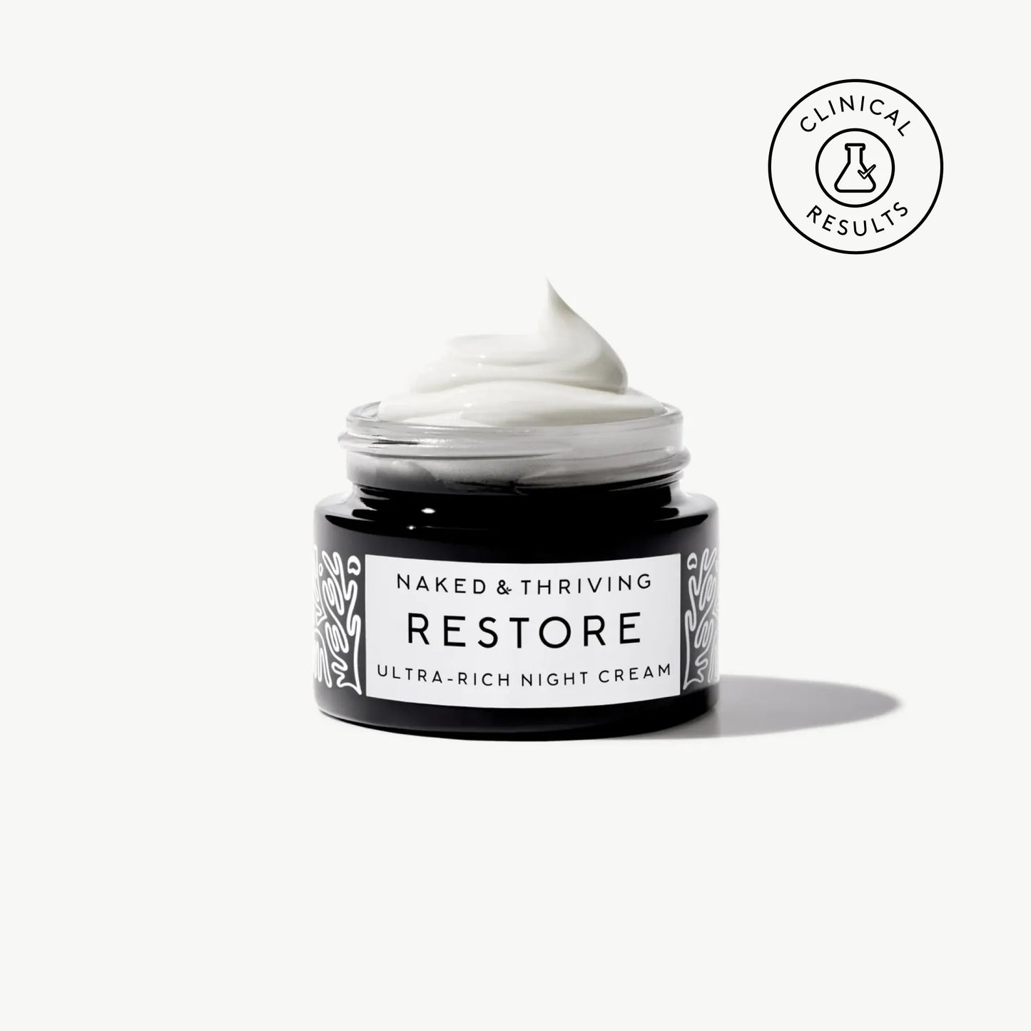 
                
                  Naked & Thriving travel-size Restore Ultra-Rich Night Cream in a black glass jar with brand label on a neutral background
                
              