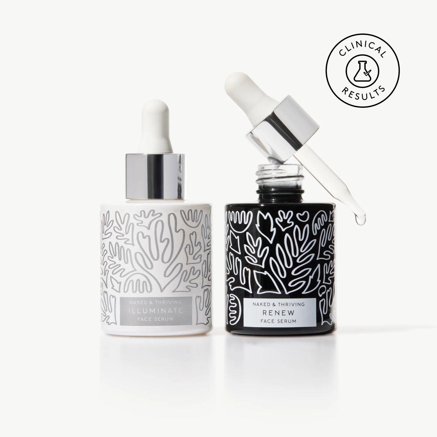 Naked & Thriving Wrinkle-Fighter Set with Illuminate BC+ Brightening Serum and Renew Resurfacing Night Serum in patterned glass bottles with dropper